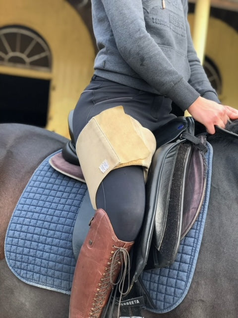 Horse rider wearing beige Equiseat Aid