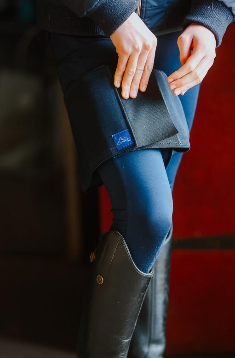 Horse rider fastening the velcro on their French Navy Equiseat Aid